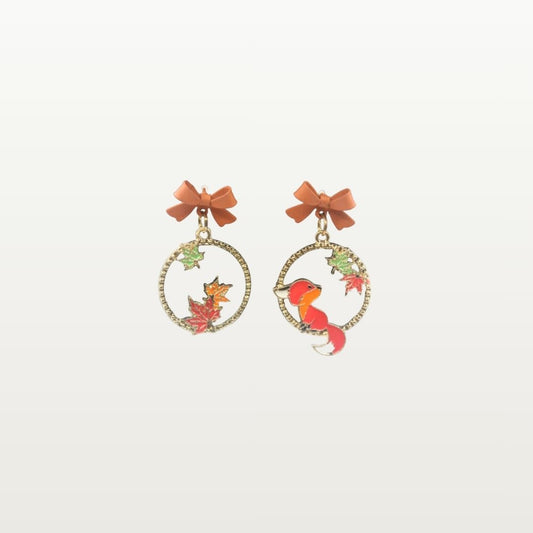 Pair of earrings with fox and leaf designs 